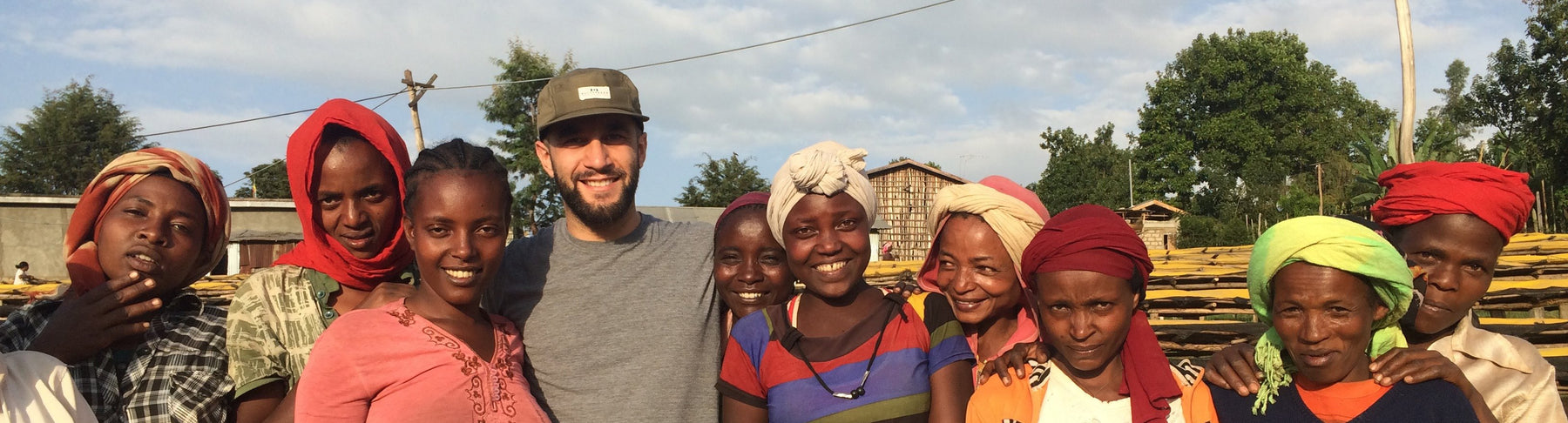 Group photo of one man and 10 women. 